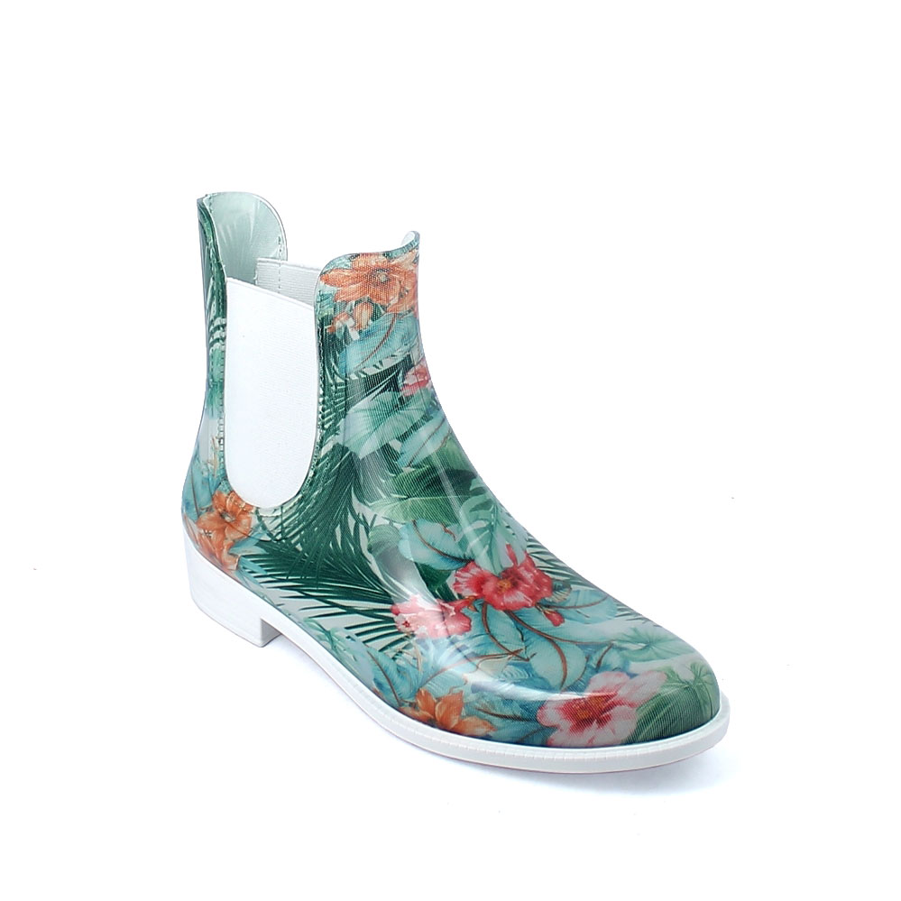 Chelsea boot in bright transparent pvc with elastic band on ankle sides and cut &sewn inner sock with pattern "Green Tropical Flowers"