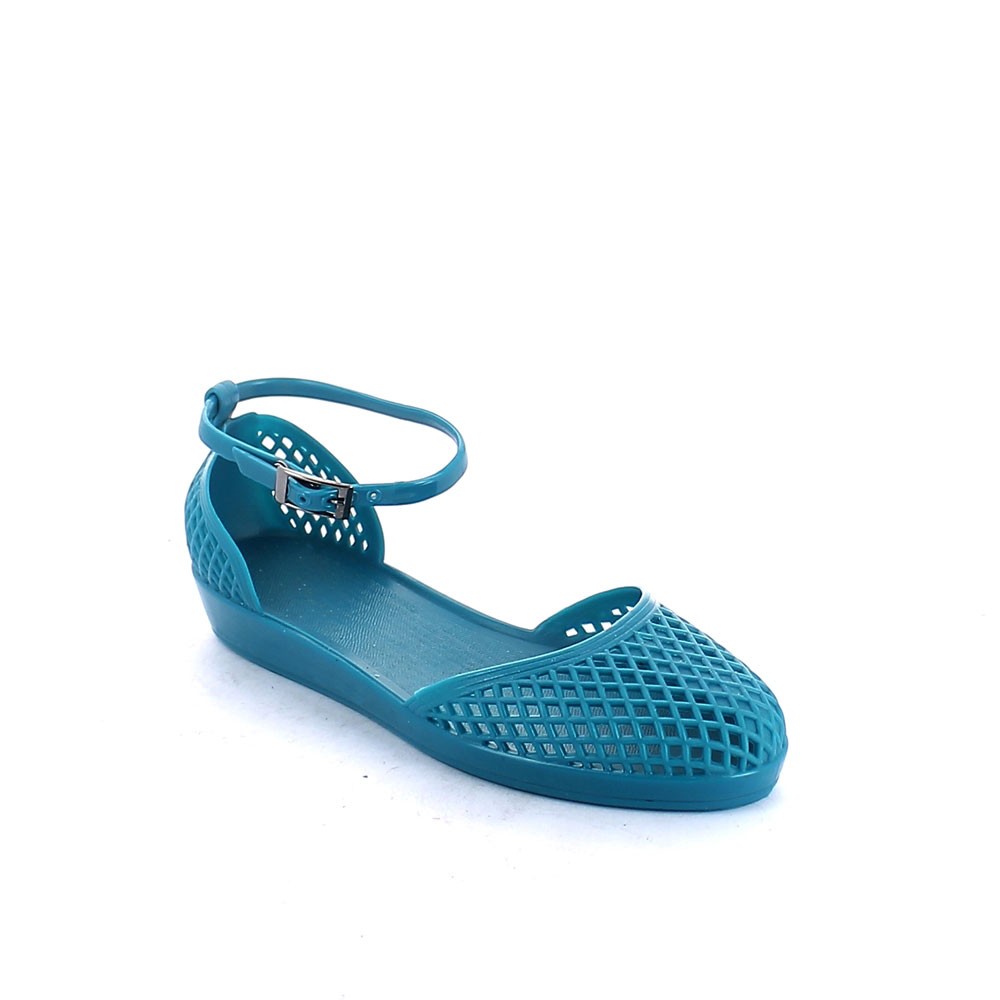 Solid colour pvc sandal with closed toe upper and strap at ankle height. Perforated upper