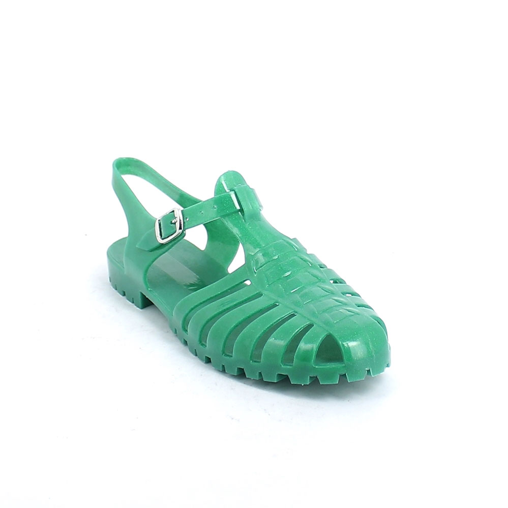 Sandalo con tomaia pvc semi-trasparente + glitter; cinturino con fibbia in metallo; tampografia sul sottopiede