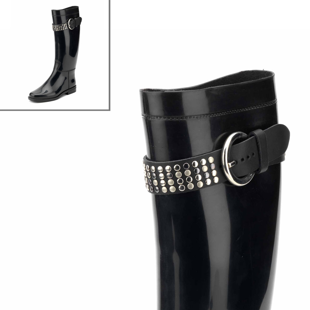 High strap made of leatherette and entirely covered with studs and with lateral round-shape buckle on pvc riding boot